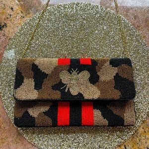 Clutch gold black red